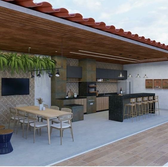 Se a sua ideia é reunir muita gente para o churrasco, invista em uma mesa, além de uma bancada que poderá ser utilizada tanto para refeições quanto para suporte.
