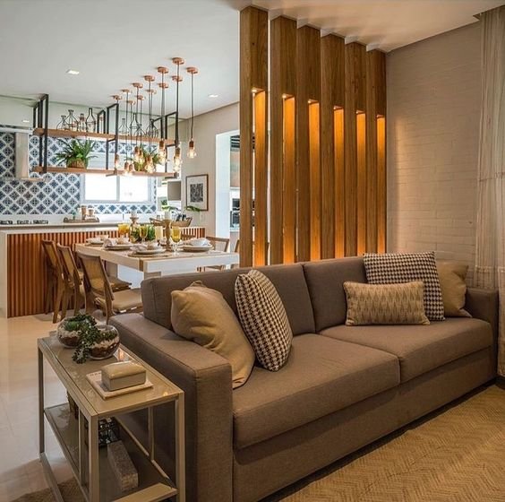 16. Vale citar ainda que a divisão não precisa ser feita por todo o espaço. Quando colocada em uma das áreas, ela já cumpre bem a sua função sem quebrar o efeito de amplitude.