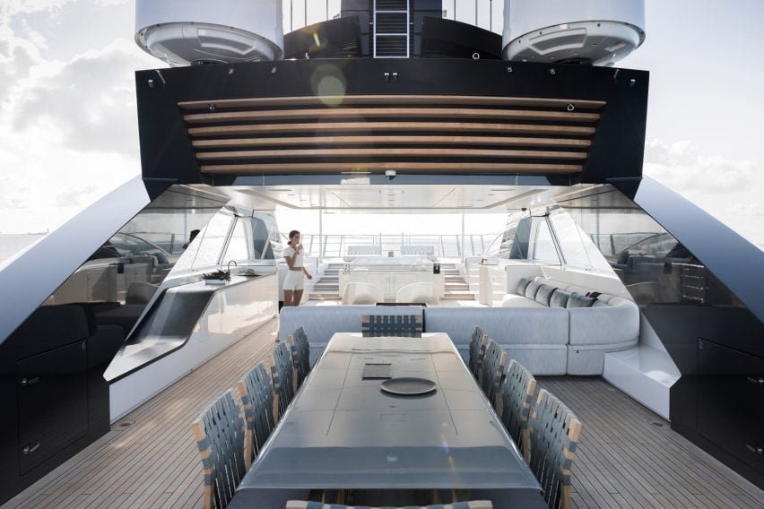 A leather-upholstered stairwell designed to resemble an unravelling ribbon leads to the lower deck.